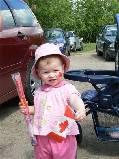 Miranda Nordin waving her Canadian Flag