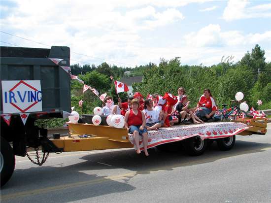 Store managers Jason and Amanda Brennan with kids on the Blackville Irving Mainway Float