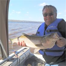 Roy catches a big Bass on the Miramichi