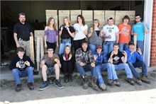 Class at MVHS build Washer Toss Boxes for Rotary